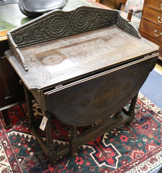 A carved gateleg table (altered) W.86cm